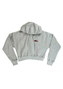 A grey E36 M3 cropped hoodie for women. Photo is a front view of the cropped sweater with an embroidered E36 M3. Fabric composition is cotton, and polyester. The material is soft, stretchy, and non-transparent. The style of this crop hoodie is long sleeve, crewneck with a hood, hooded, with embroidery on the chest.