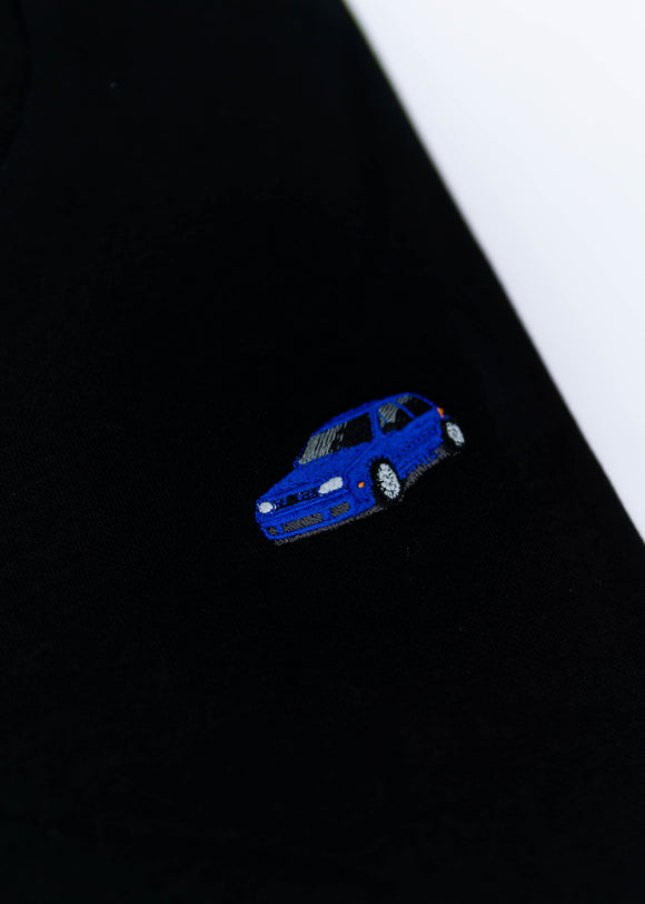 A black Mk4 Golf R32 crewneck sweater for men. Photo is a close up of the sweater with an embroidered Mk4 Golf R32. Fabric is a cotton and polyester mix and high quality and fits to size. The style is long sleeve, crew neck, and embroidery on left chest.