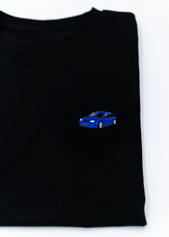 A black Mk4 Golf R32 T-Shirt for men. Photo is a close up view of the shirt with an embroidered blue Mk4 Golf R32. Fabric composition is 65% polyester, and 35% cotton. The material is very stretchy, soft, comfortable, breathable, and non-transparent. The style of this shirt is short sleeve, with a crewneck neckline.